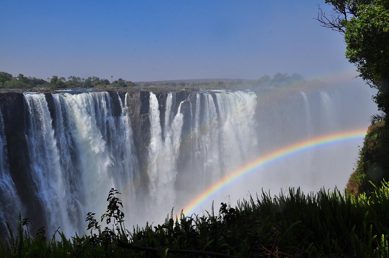 rainbow, waterfall, water, landscape, nature, outdoors, sky, travel, river, scenic, summer, environment, fall, spray, panoramic, victoria falls, zimbabwe, zambia, africa, stream, tourism, panorama, landmark, natural, rock, cascade, vacation, destination, dramatic, amazing, extreme, adventure, attraction, blue rainbow, blue waterfall, blue river, blue rock, victoria falls, victoria falls, victoria falls, victoria falls, victoria falls, zimbabwe, zambia